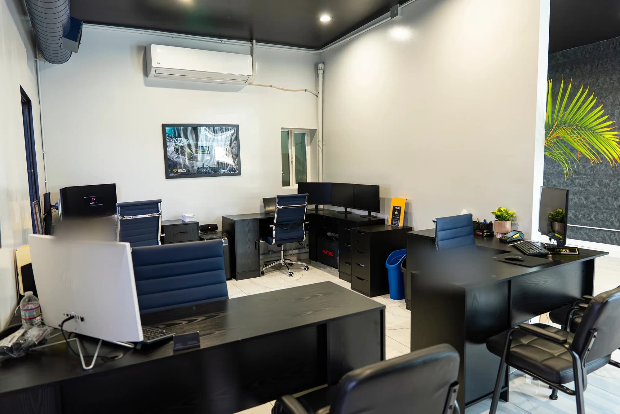 The estimating office at GEM Collision, with workstations where repair estimates are written